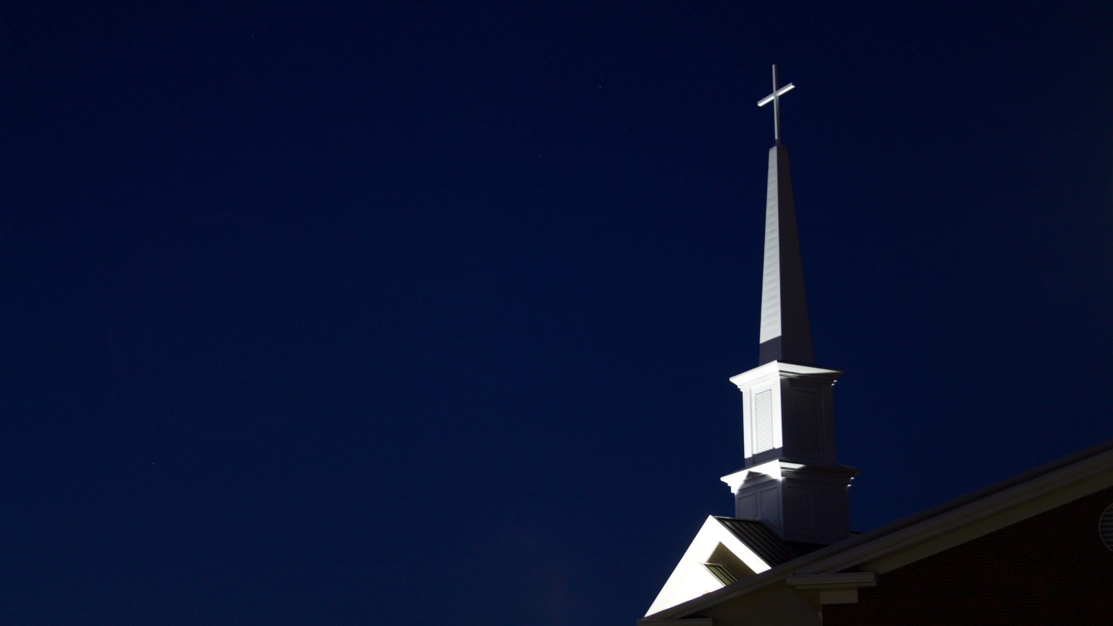 reconciliation and redemption in the bible, church and tower against blue skies